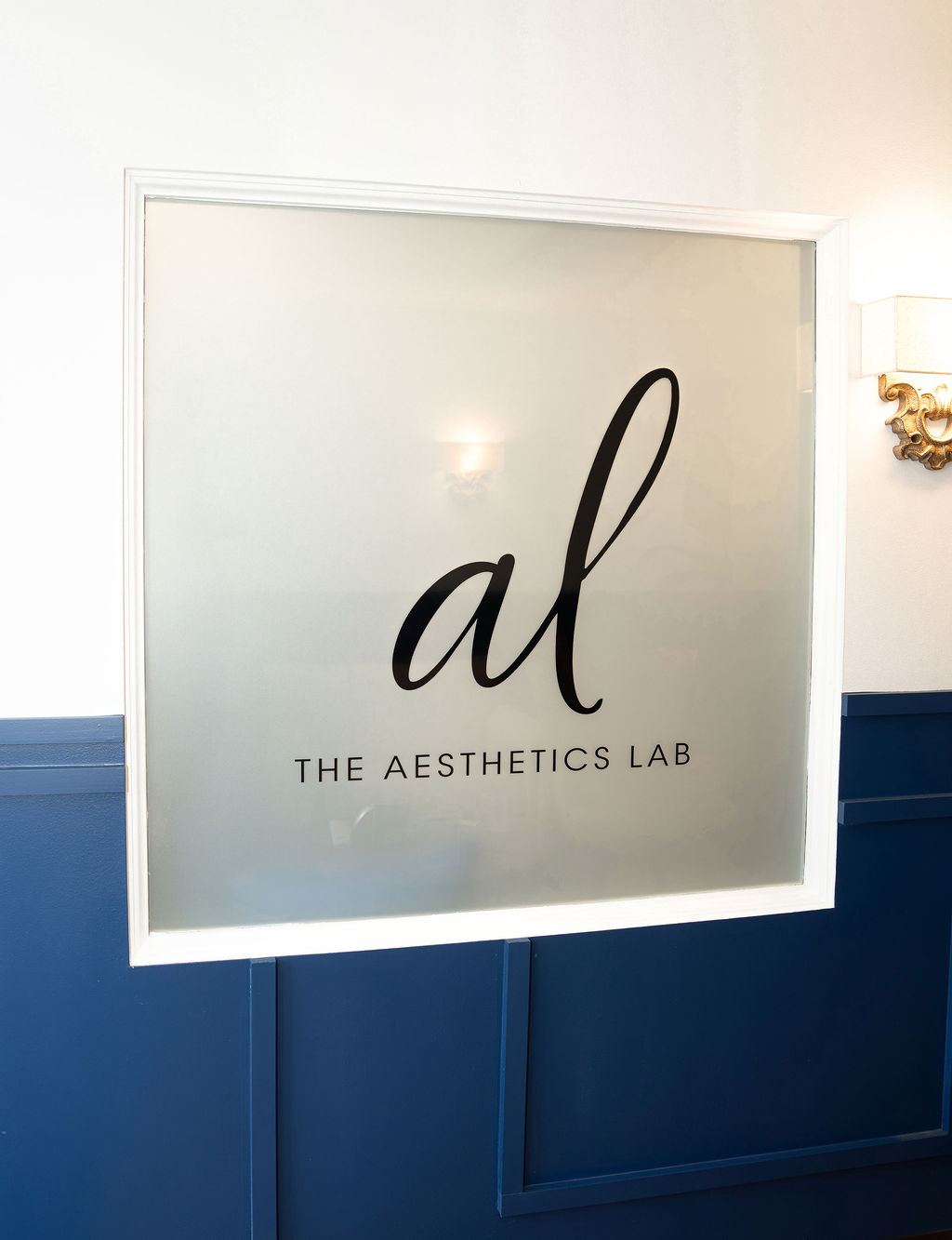 The Aesthetics Lab glass sign